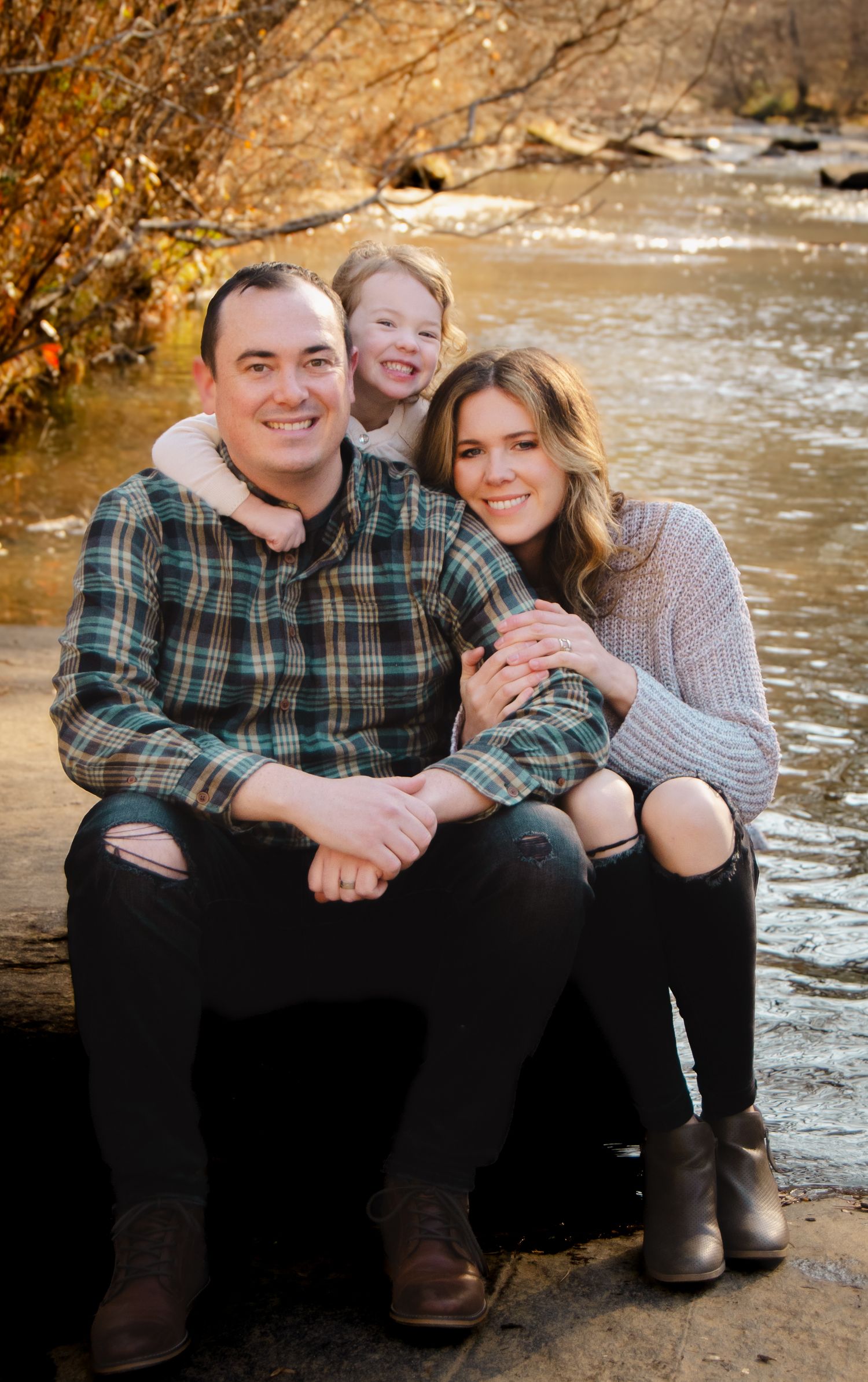 Casual autumn creek side photos showing joyful moments together.