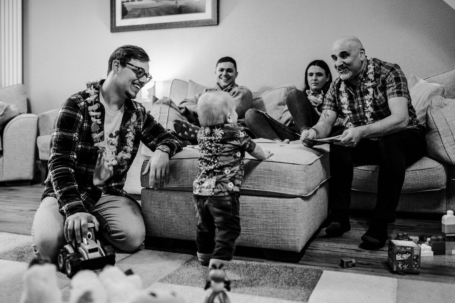 black and white photo of birthday boy surrounded by his family members
