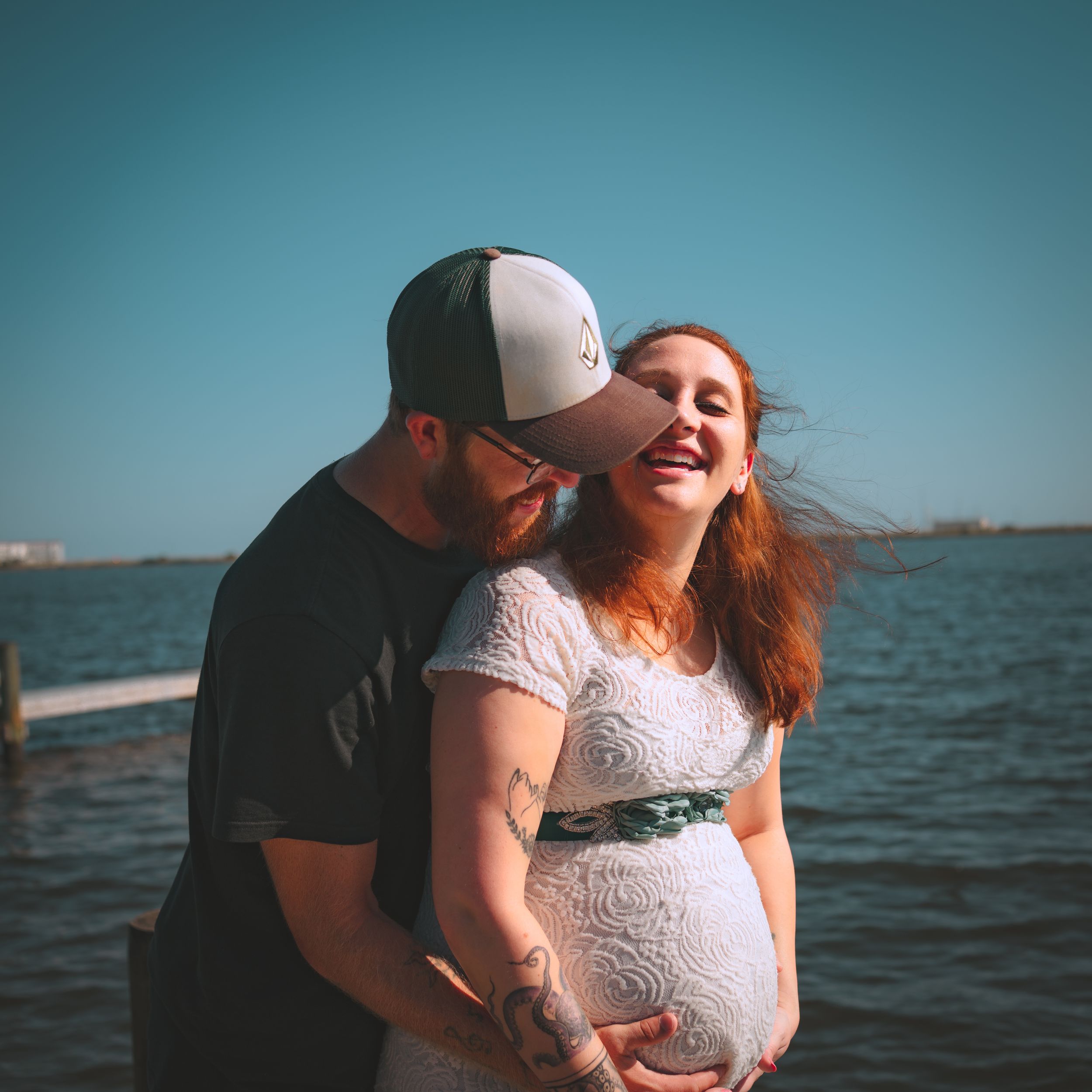 Outdoor maternity session capturing movement and connection, photographed by Sierra Lopez Productions.
