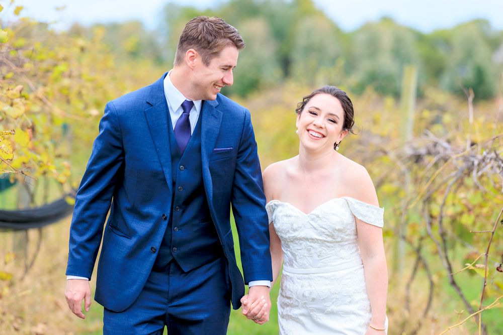 Couple Walking Through Vineyard During Wedding at Gervasi Vineyard in Canton, Ohio