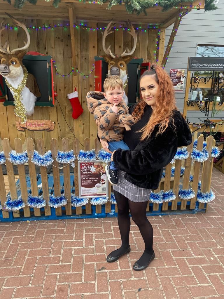 Mother and Son at christmas event wearing coats by local photographer in DN7.
