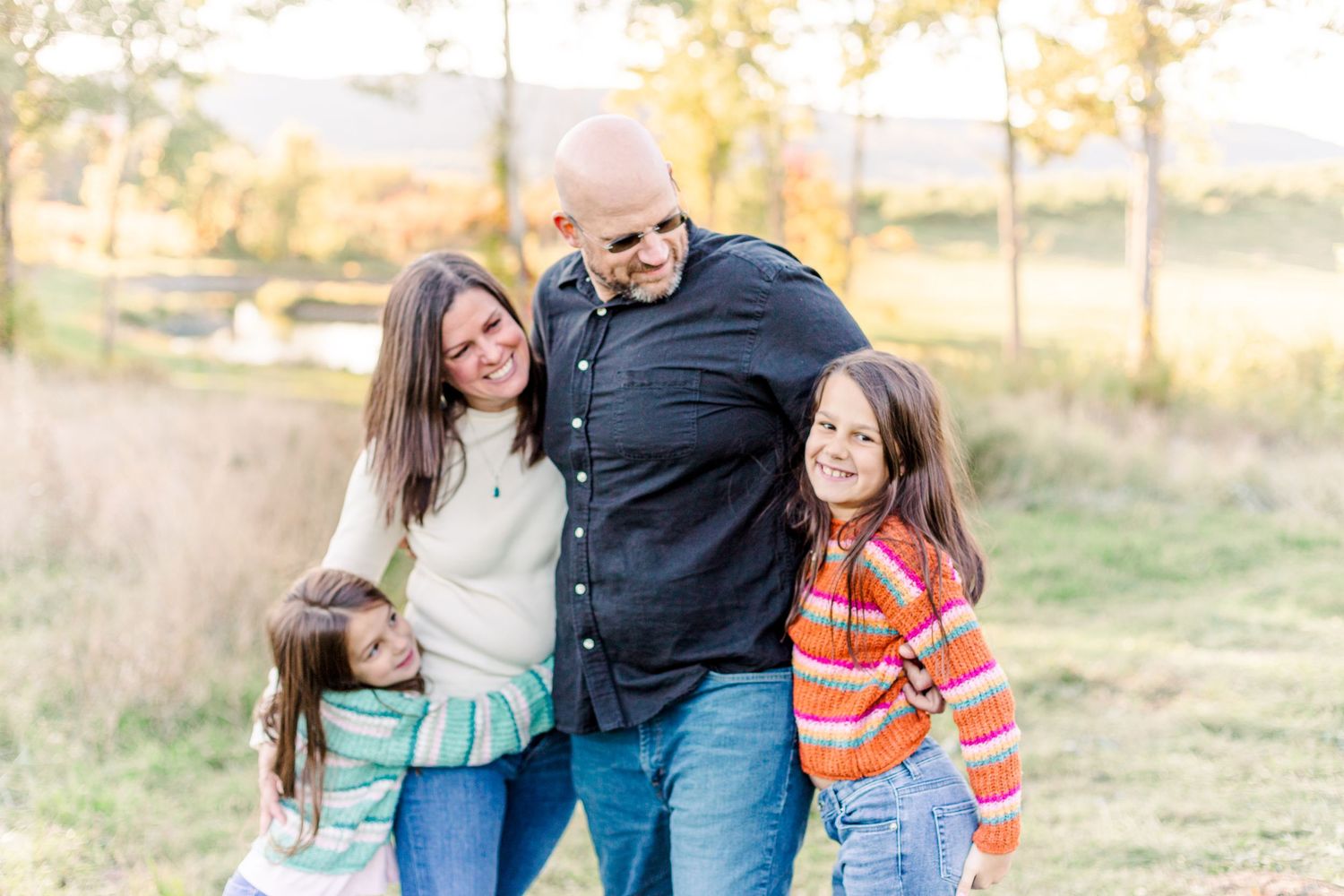 Family of four smiling during a Fall Family Session at a Hudson Valley Winery