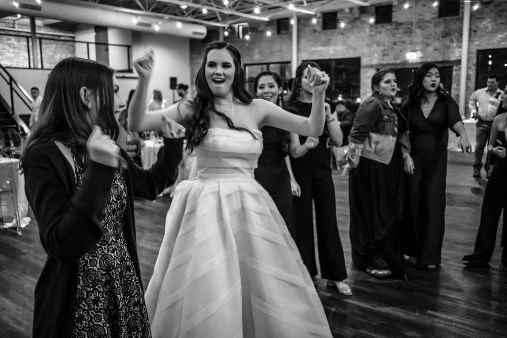 bride and guests dancing at wedding reception in Dallas, TX