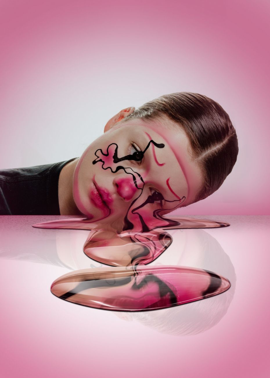 Surreal pink melting face art with black swirls, creative liquid effect photography on pink background.