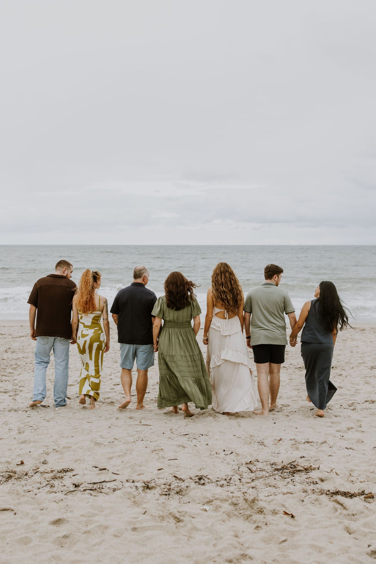 Large family photos in Downtown Palm Beach on the island, at a park and the beach captured by Lindsay McDow Photography