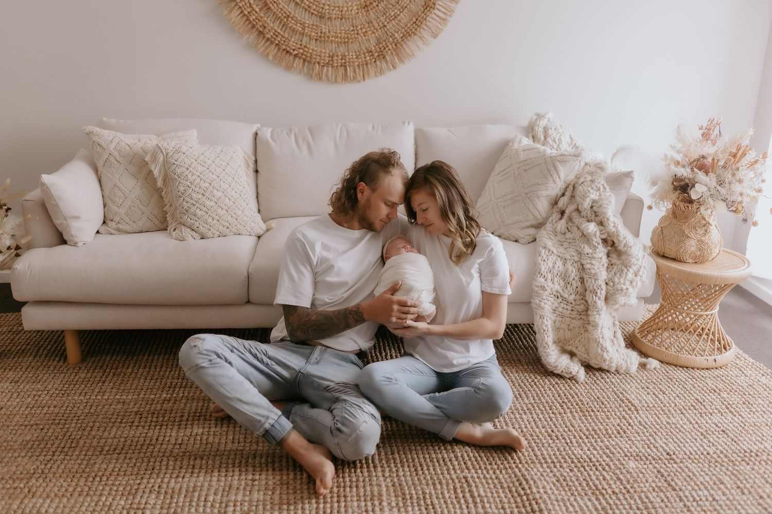 Modern minimalist indoor photoshoot with neutral tones and woven decor elements.