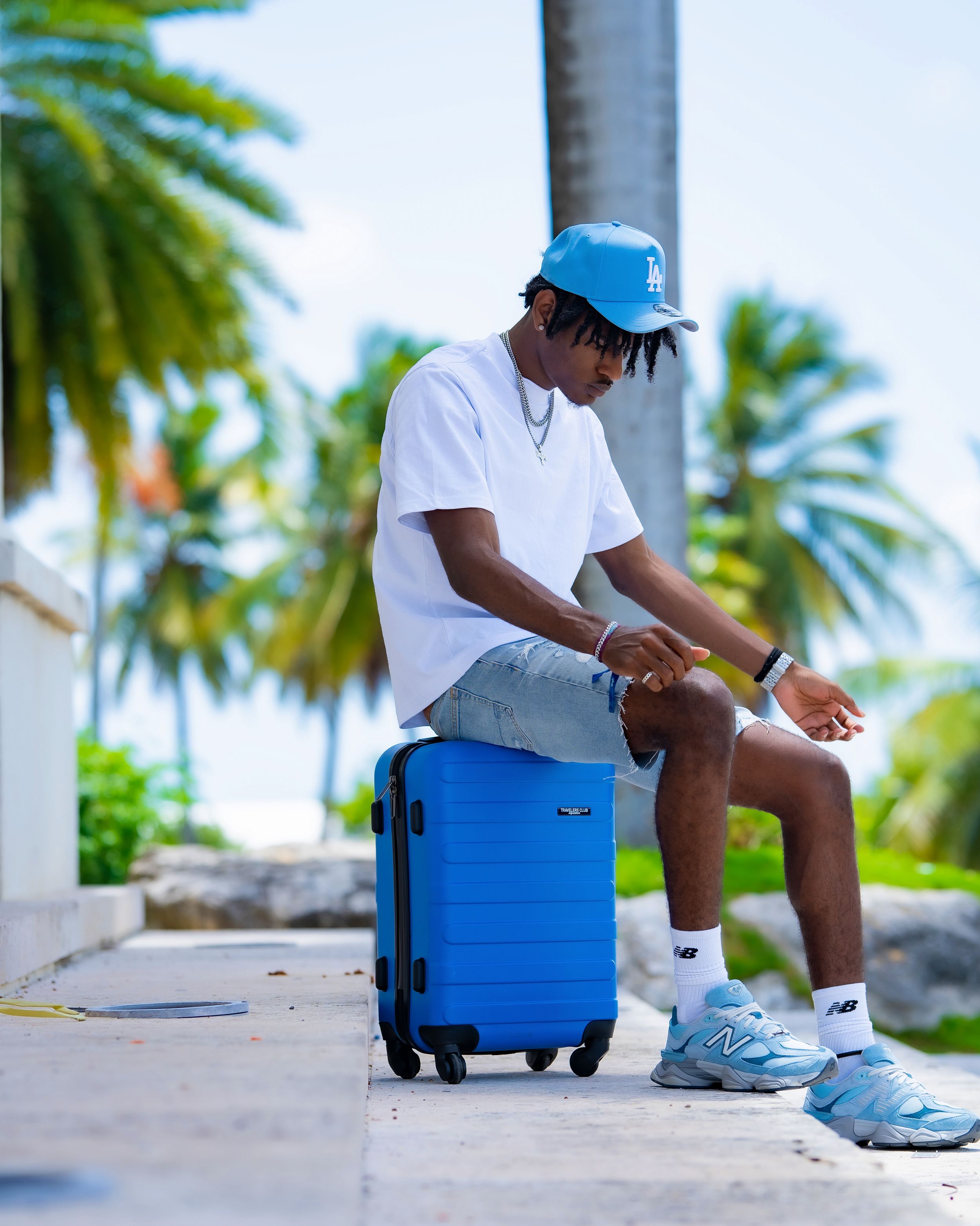 Outdoor portrait with suitcase — travel lifestyle by Timoy B Photography in Antigua.