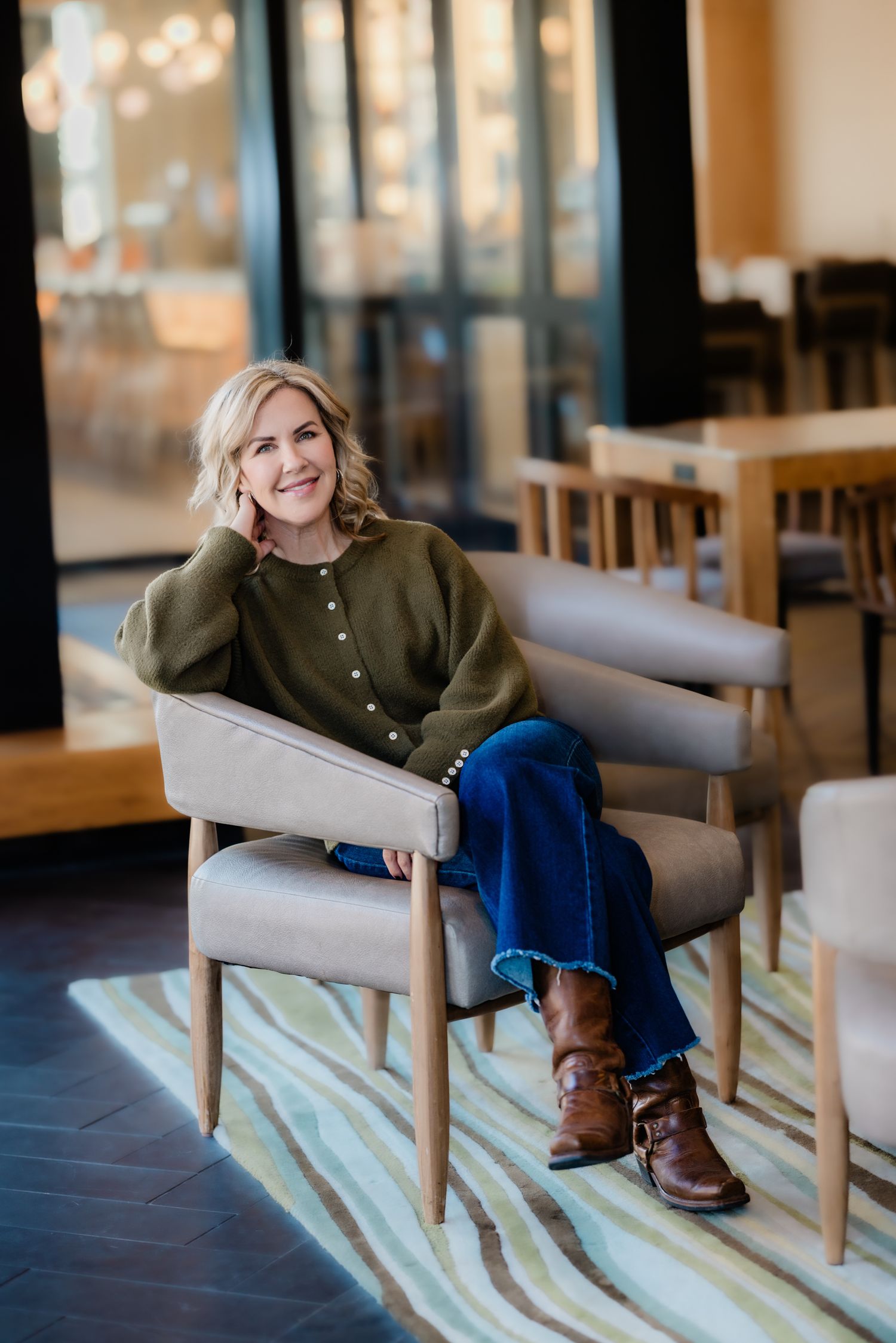 A female business owner reviews her brand content portraits, ready to share her authentic story with followers on Instag