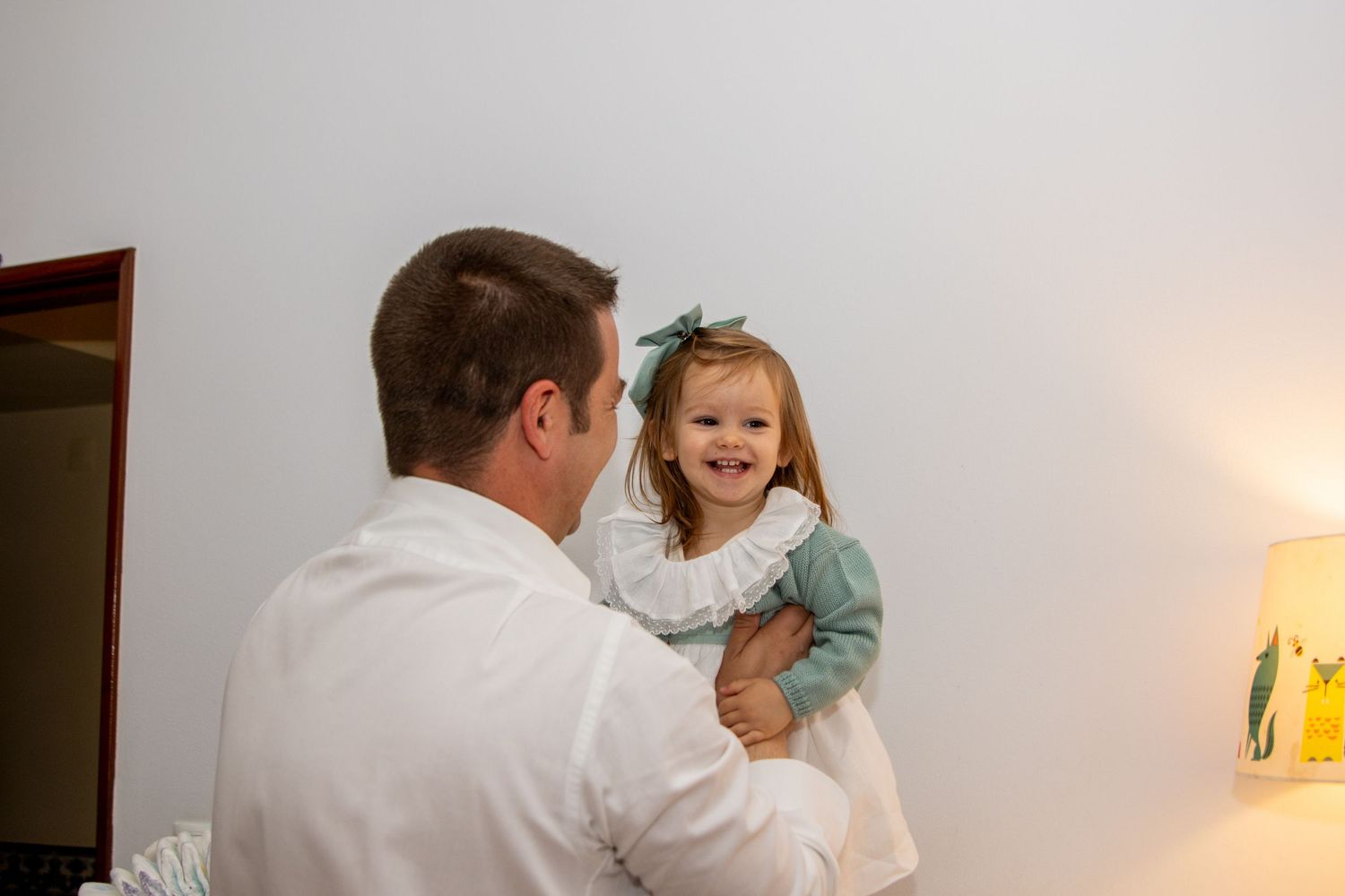 Joyful family moments captured in a series of casual indoor photos.