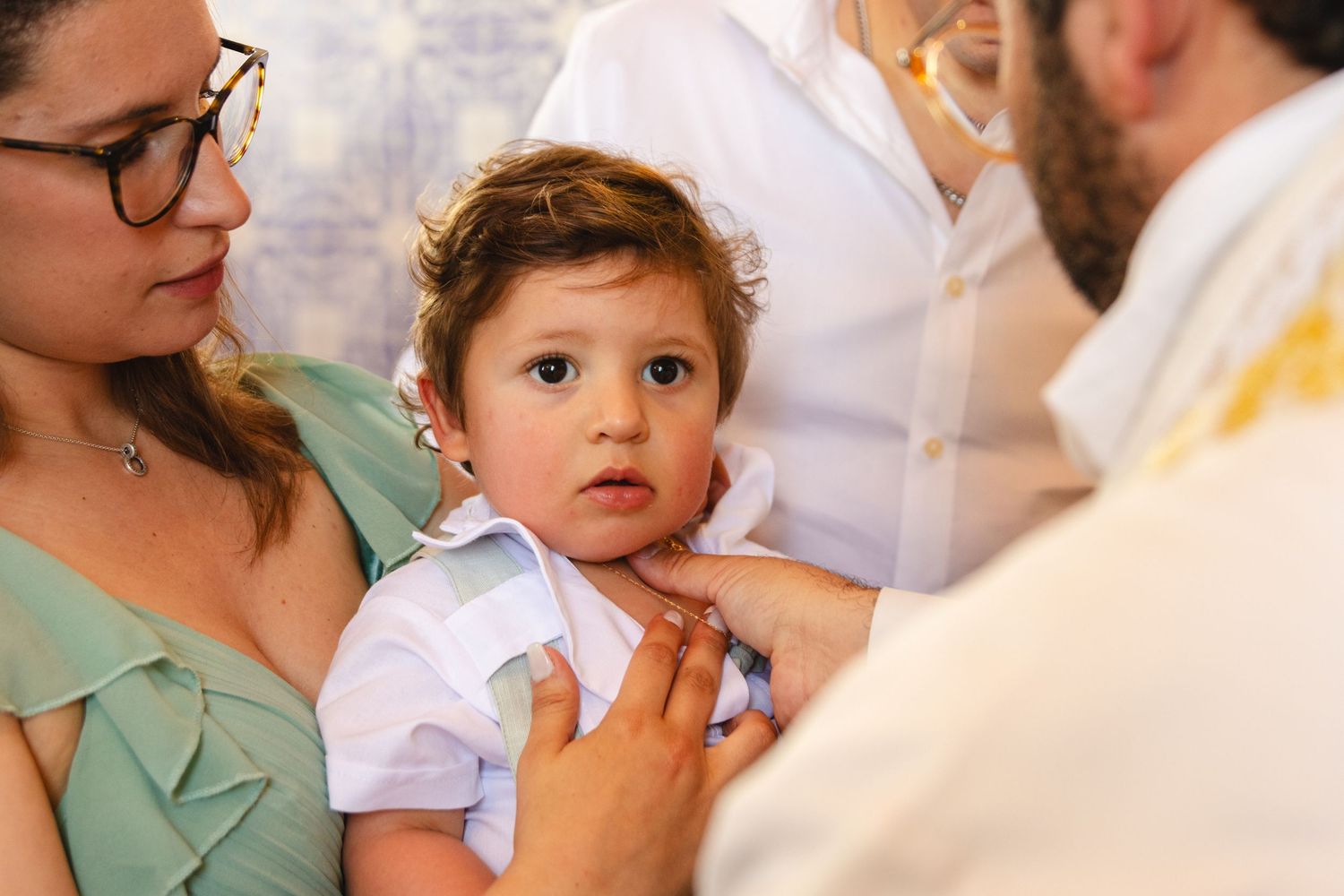 Close-up of baptism ceremony in traditional church setting.