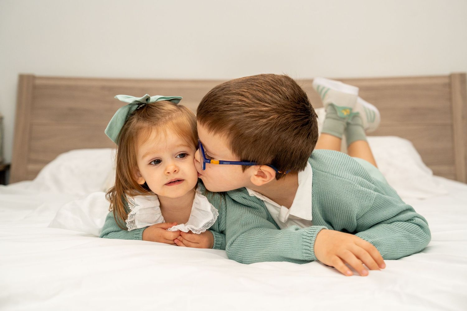 Candid shots of family members sharing laughs while relaxing on bed.