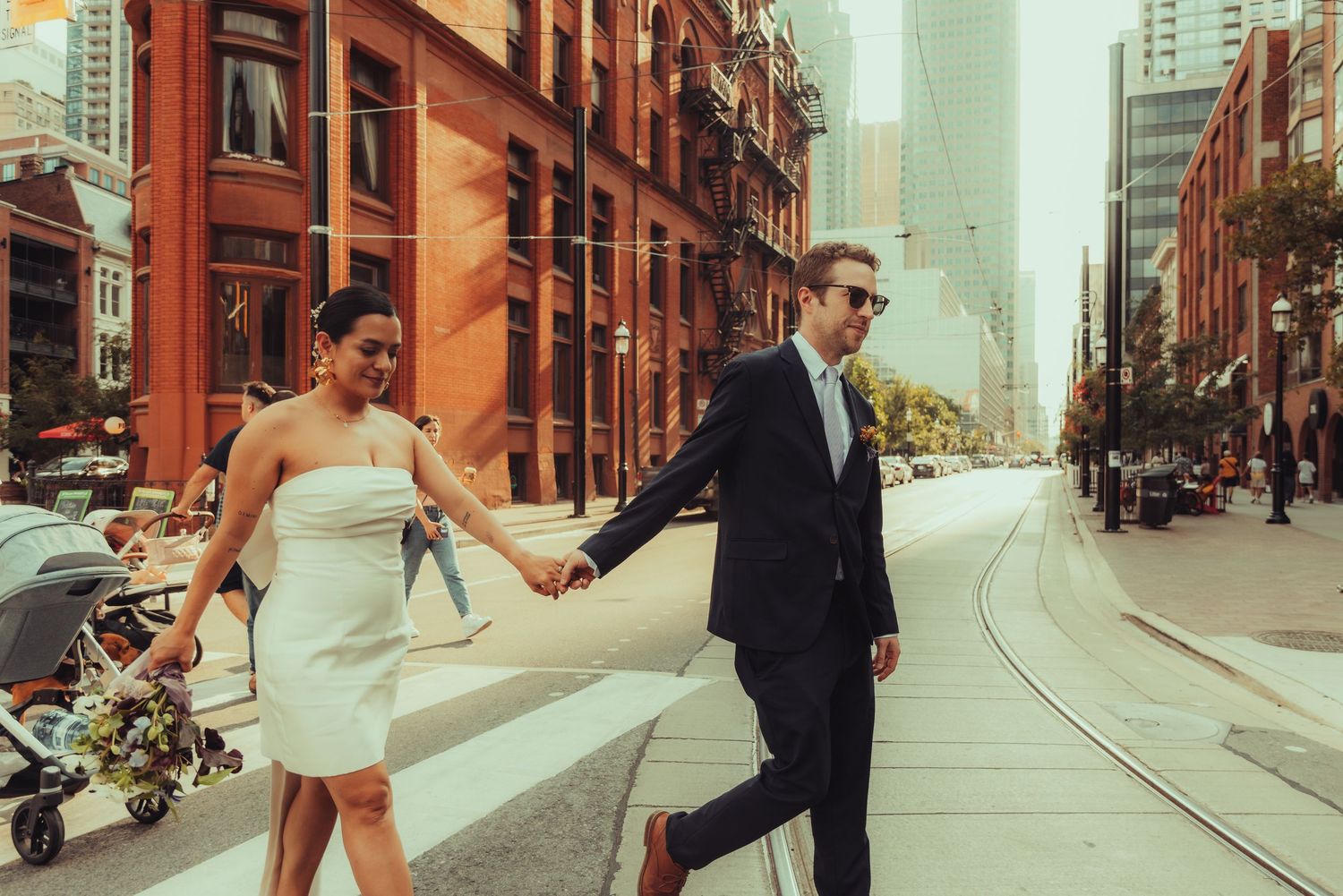 Bride and groom sharing a kiss during golden hour outdoor ceremony