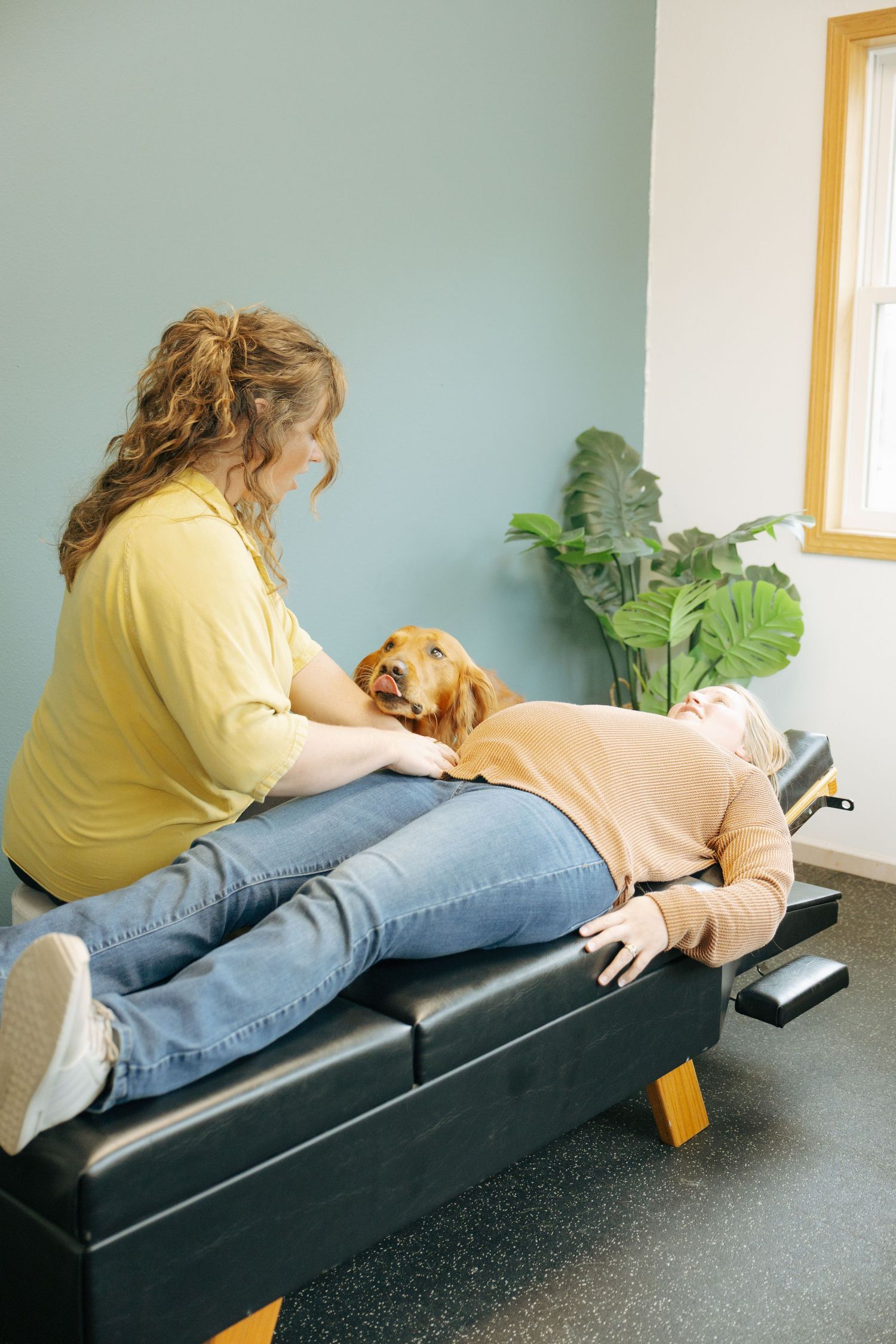 Person receiving chiropractic adjustment on treatment table.