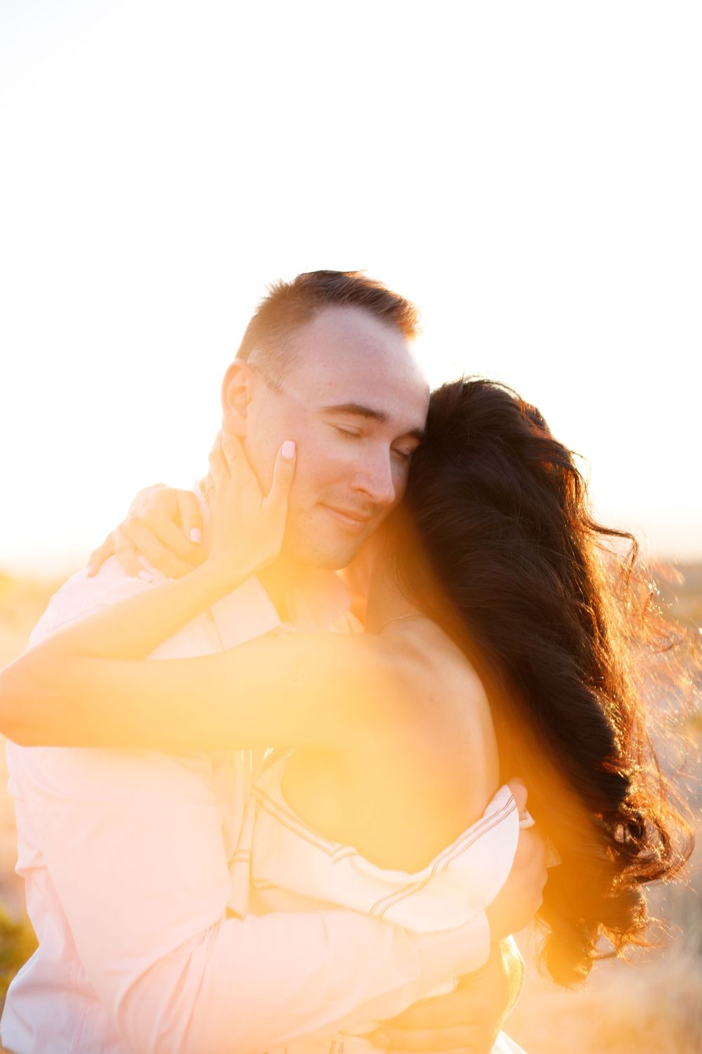 Engaged couple at sunset