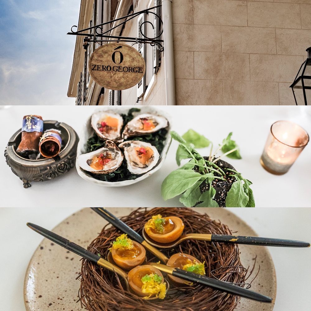 Sushi rolls, greens, and noodle bowls are arranged artistically on a rustic wooden surface.  Dining at Zero George in Charleston, S.C..