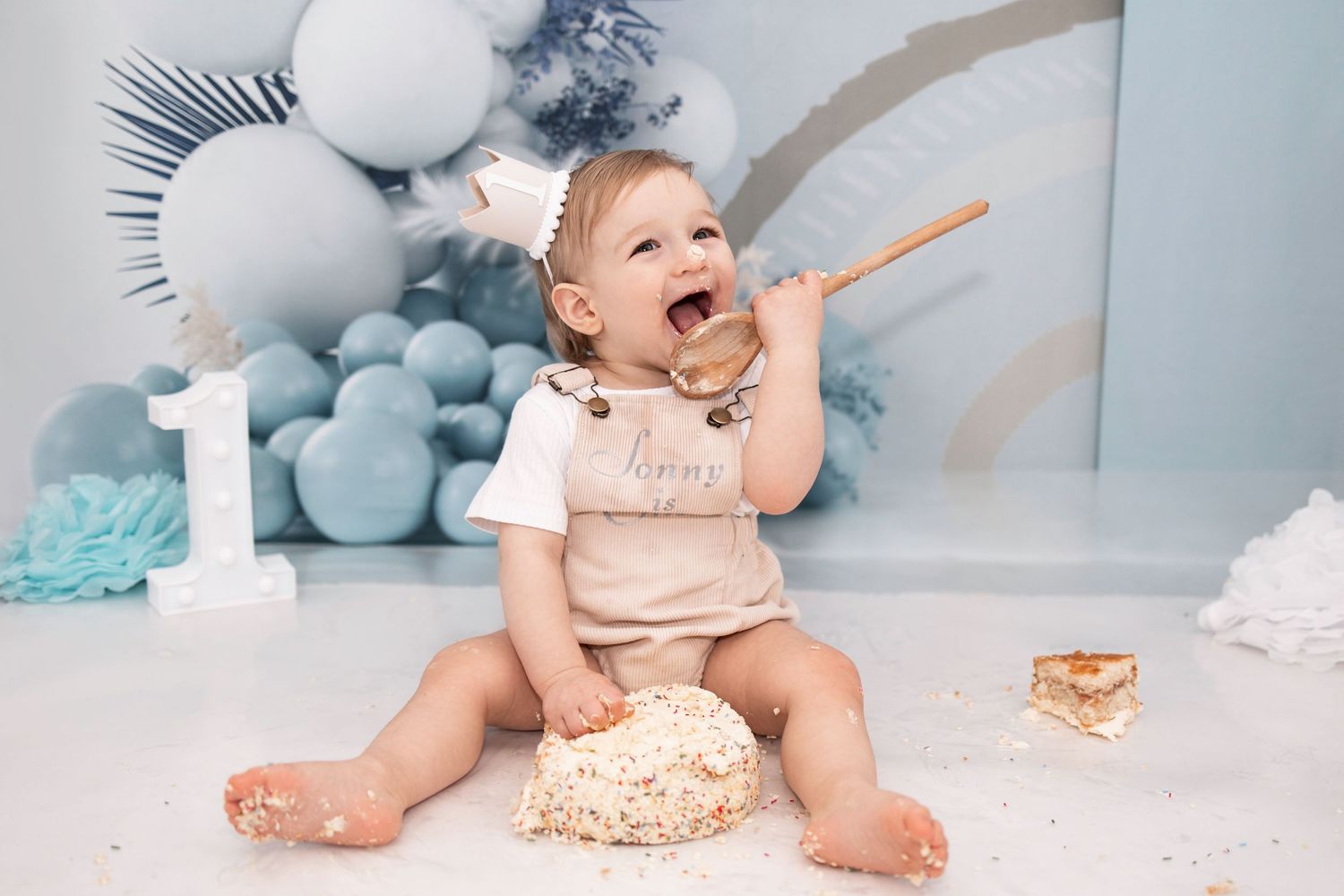 baby boy first birthday cake smash and splash blue balloons Tameside photographer photography