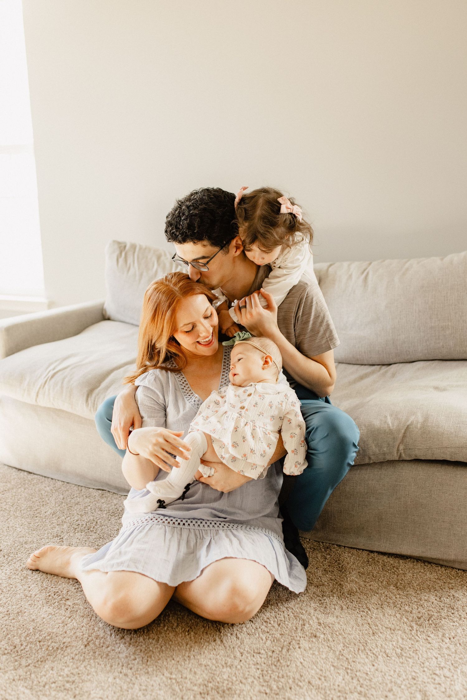 DC Family Cuddled up on couch in Montgomery County, MD.