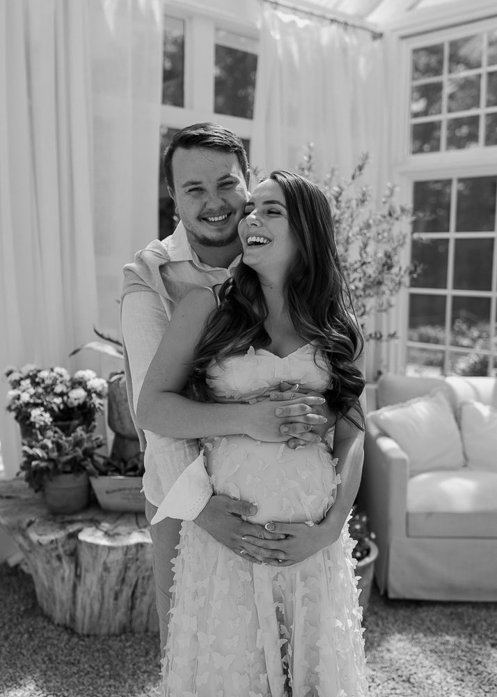 Lovely maternity portraits at Fleurish Greenhouse in Taylorsville, NC.