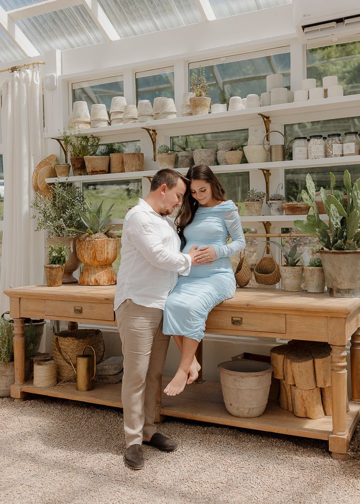Lovely maternity portraits at Fleurish Greenhouse in Taylorsville, NC.