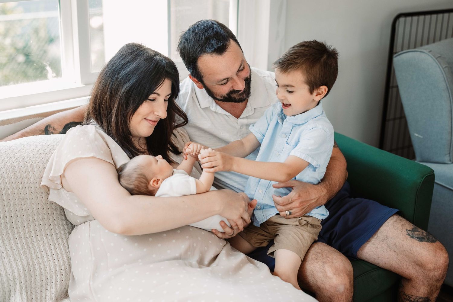 Family enjoys quality time together while viewing content on digital tablet in modern home setting.