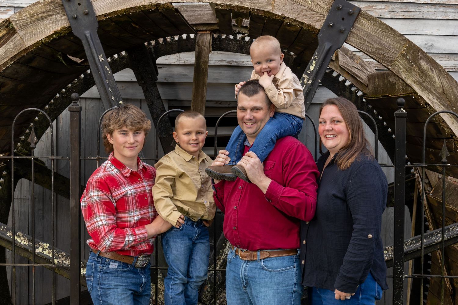 Famiyl in jeans and flannels in front of the old mill Daretown NJ. Salem and Gloucester County Family Photographer