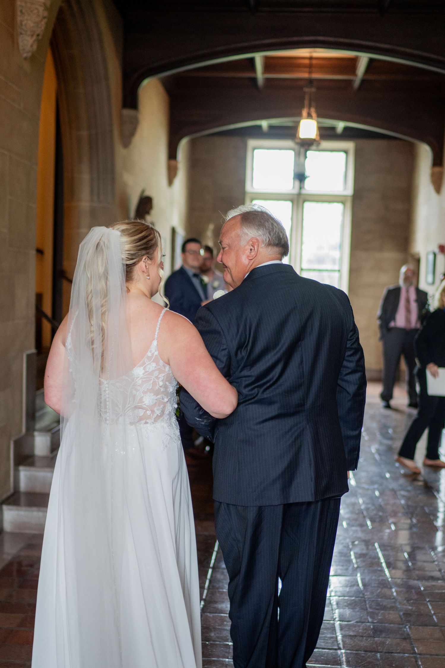 Father and daughter getting ready to walk down the aisle at the Grosse Pointe Academy Chapel.