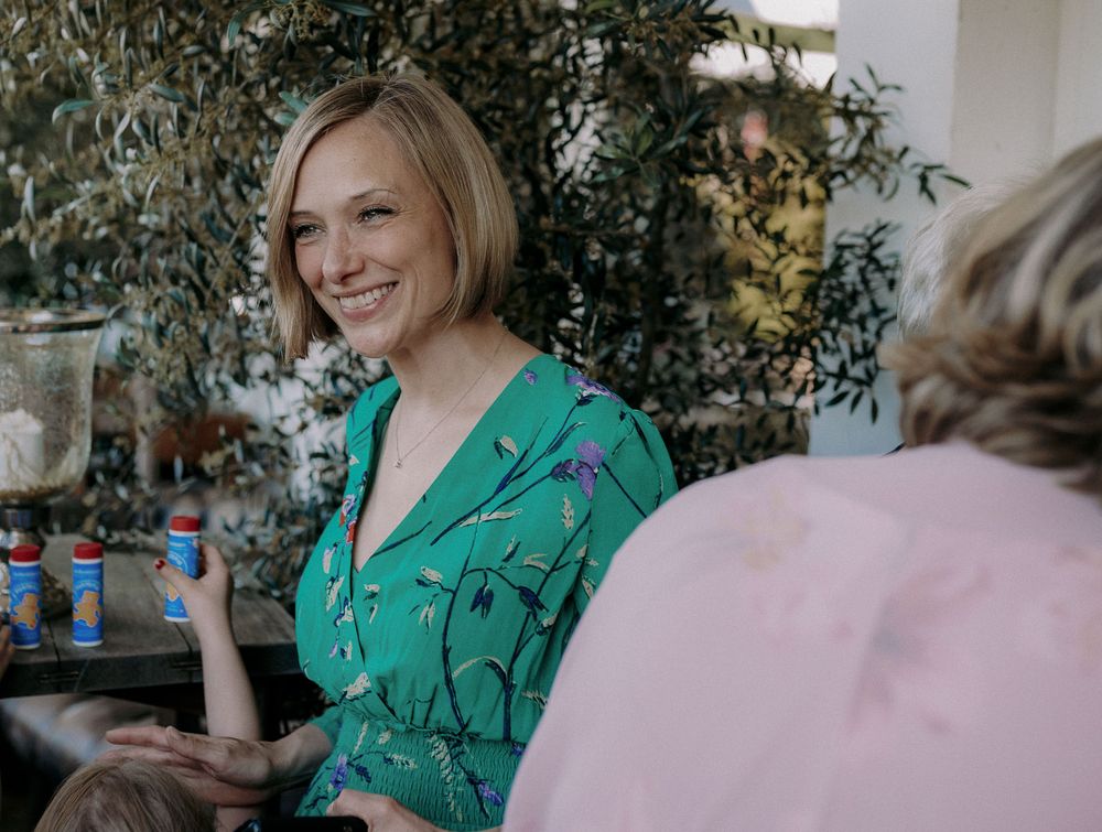 Guest enjoying refreshments at outdoor social event.