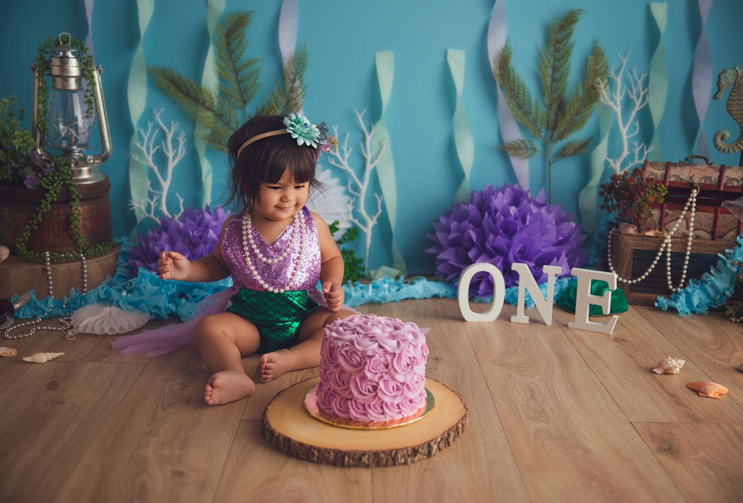pink cake and happy baby girl mermaid themed session