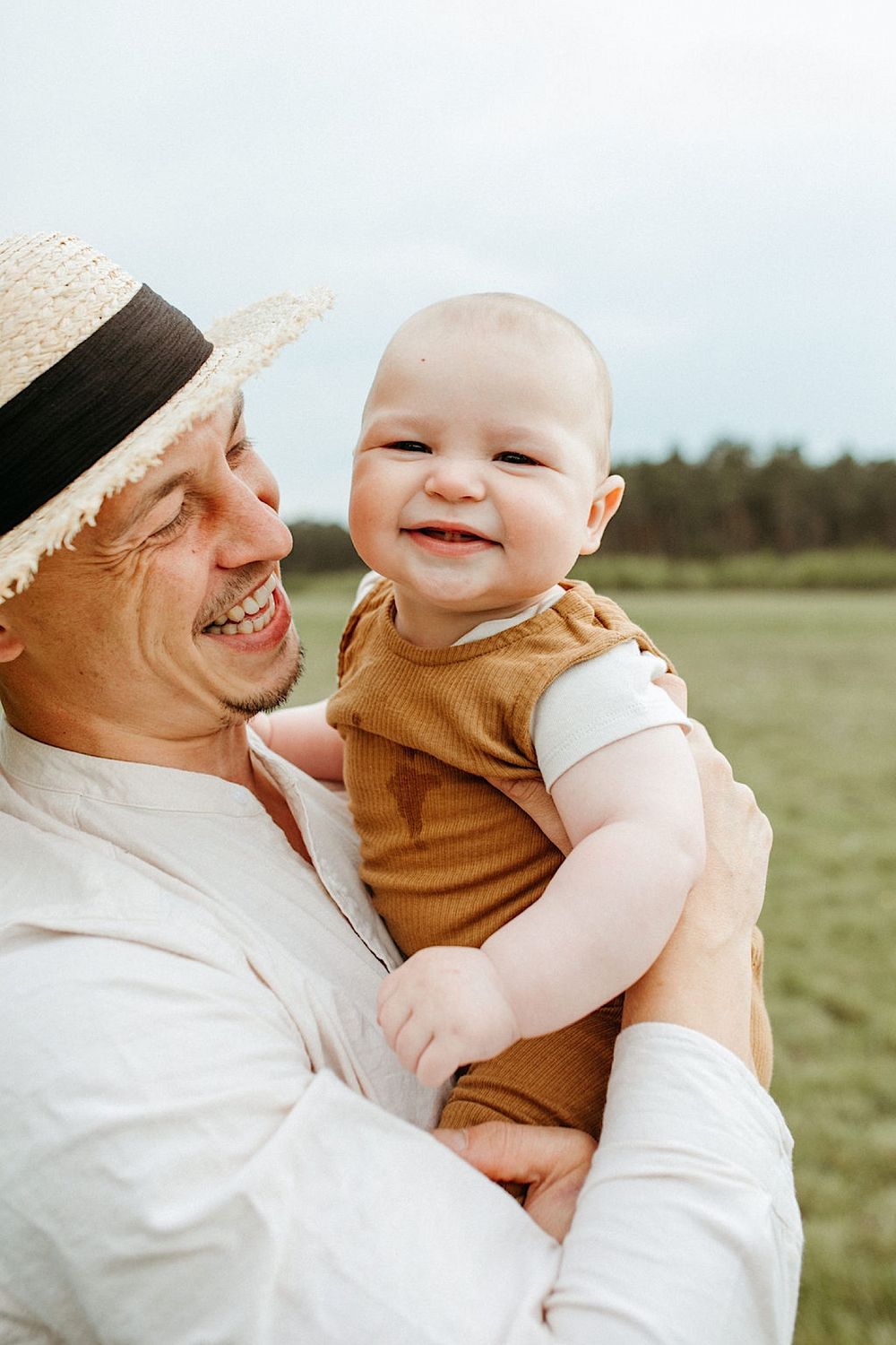 Intimate family moments captured in warm sunlight against a pastoral backdrop.