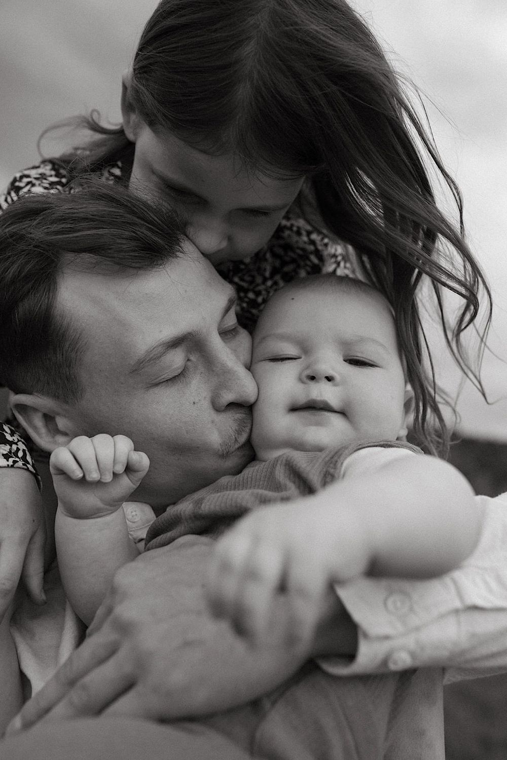 Series of intimate black and white close-up shots showing affection and connection.