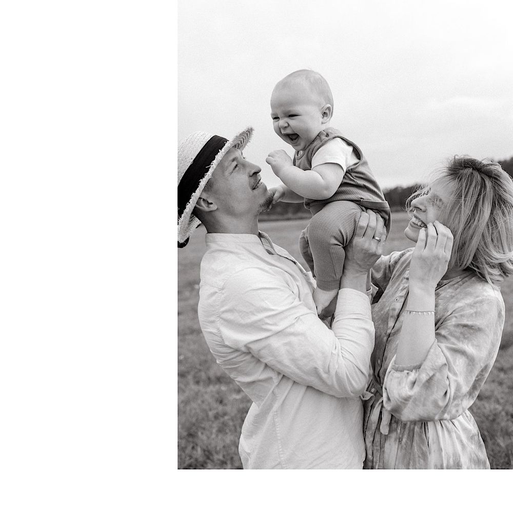 Black and white photo showing tender family moments in an outdoor setting.