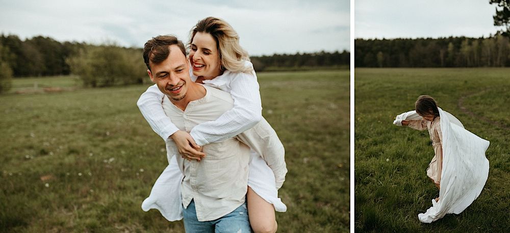 A couple enjoys a romantic moment in a grassy meadow with trees in the background.