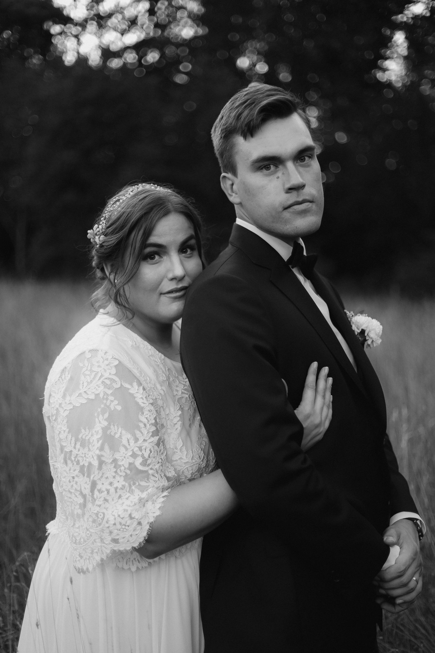 Classic black and white wedding portrait in formal attire.