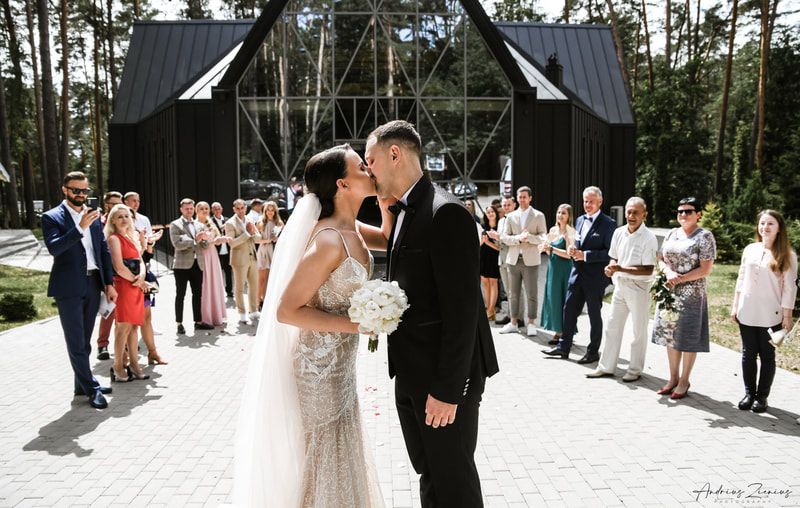 Outdoor wedding ceremony photos showing couple and guests in forest setting.