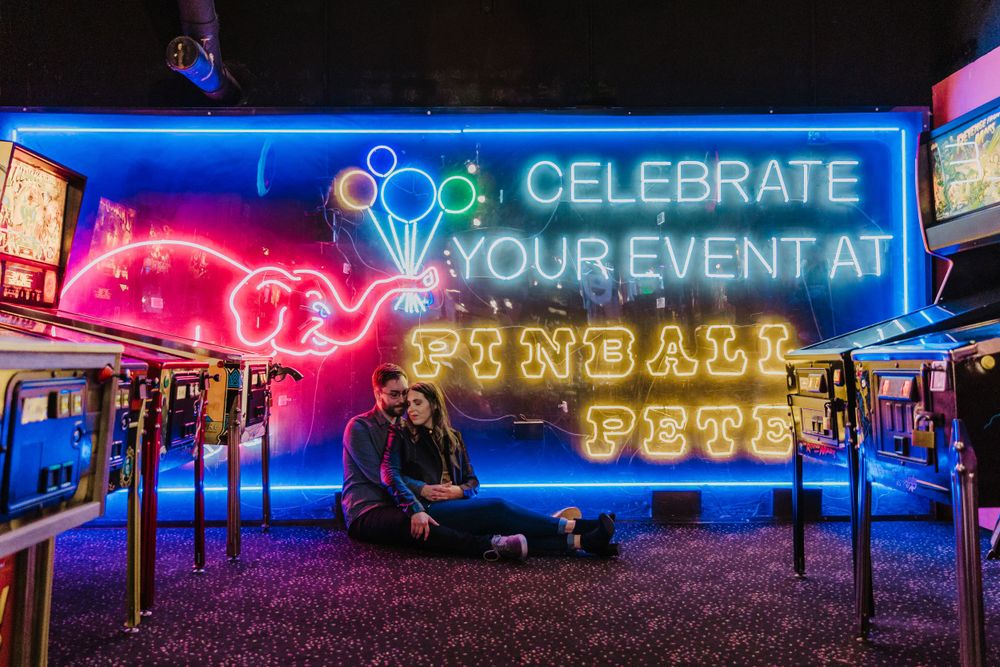 Engagement photo session at Pinball Petes in Ann Arbor Michigan capturing genuine moments of love and connection