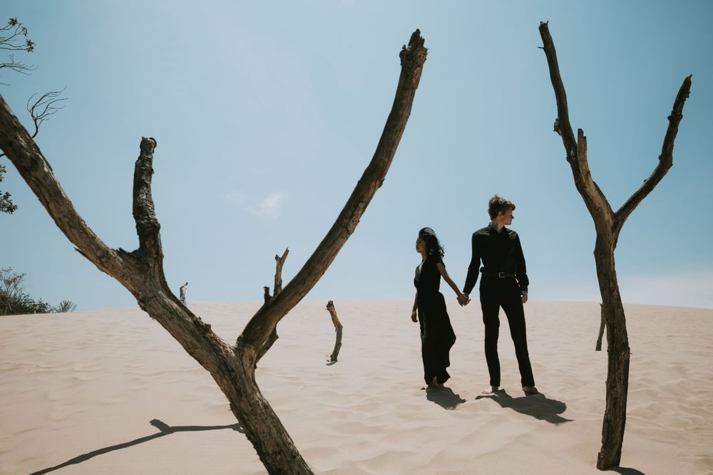 Engagement photo session at the Silver Lake Sand Dunes in Michigan capturing genuine moments of love and connection