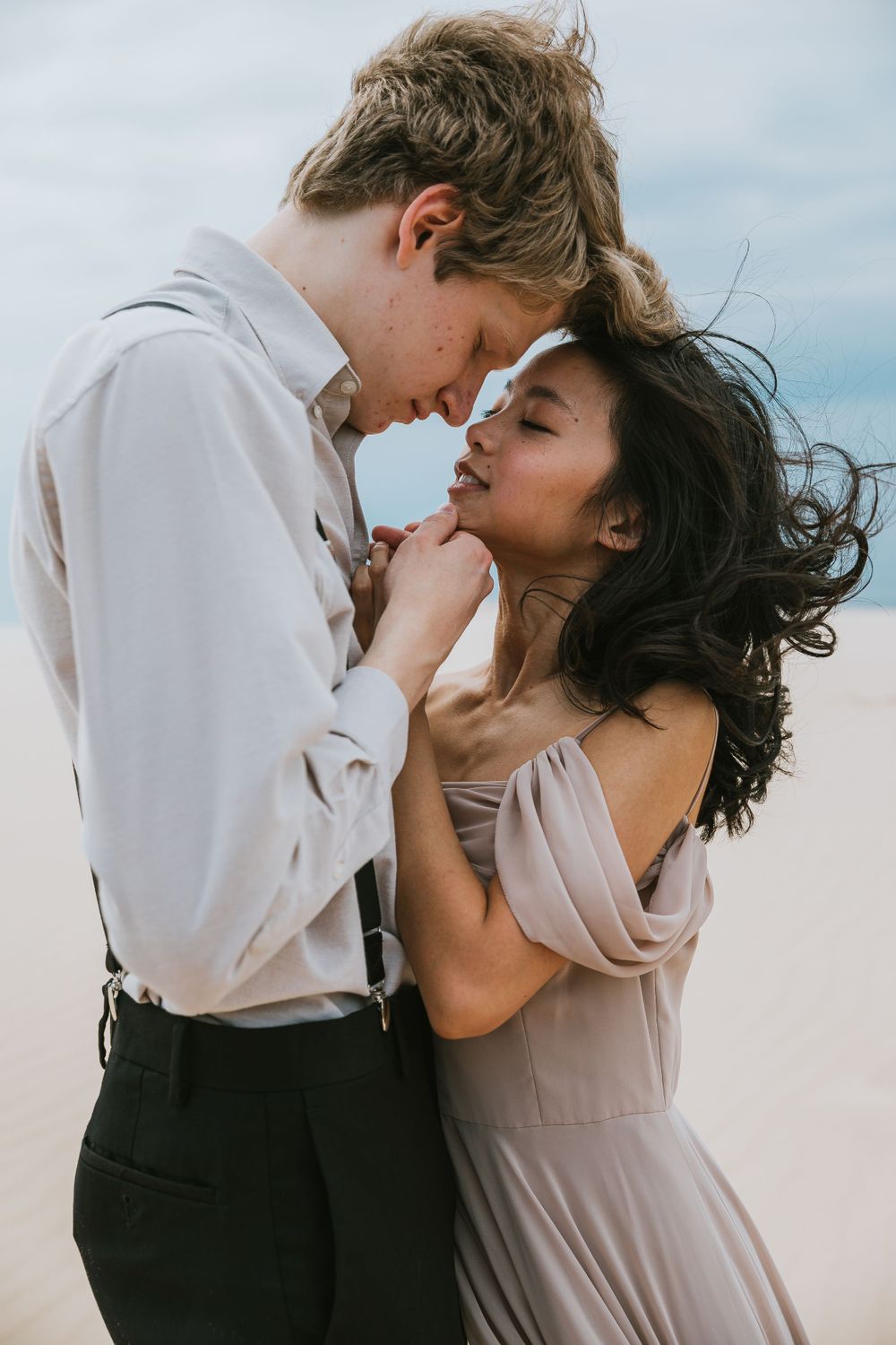 Engagement photo session at the Silver Lake Sand Dunes in Michigan capturing genuine moments of love and connection