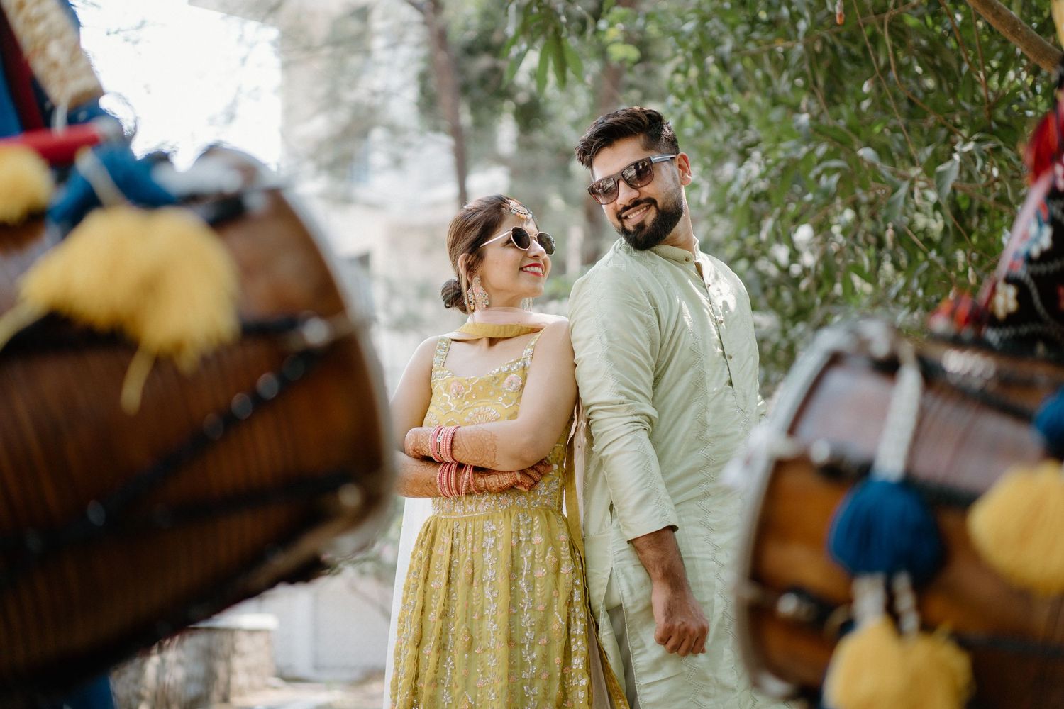Outdoor celebration scene with decorative marigold garlands and festive atmosphere.