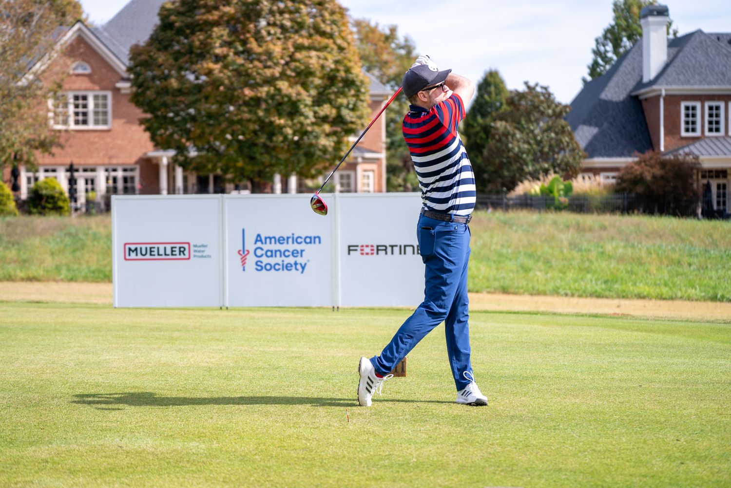 man swinging a golf club