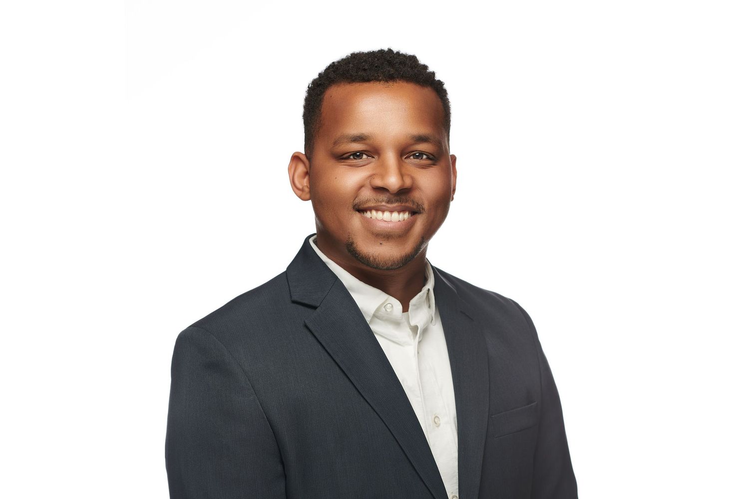 Professional headshot portrait against white background.