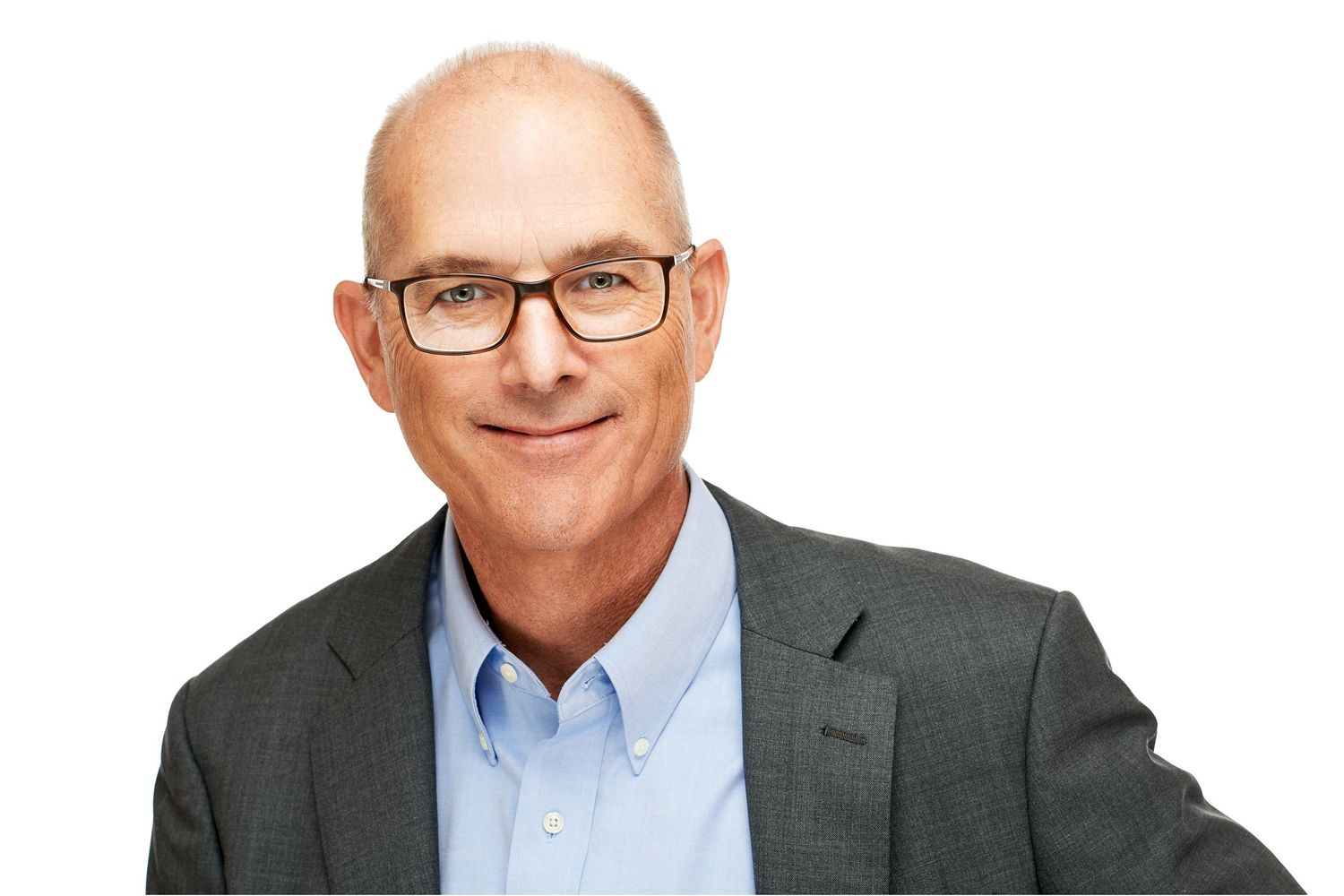 Professional headshot portrait against orange background.