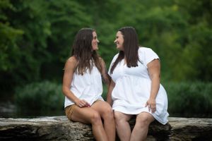 two women looking at each other and smiling