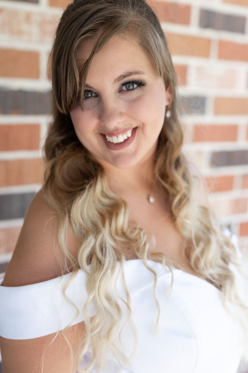 A series of close-up portraits showing joyful expressions against a brick wall background.