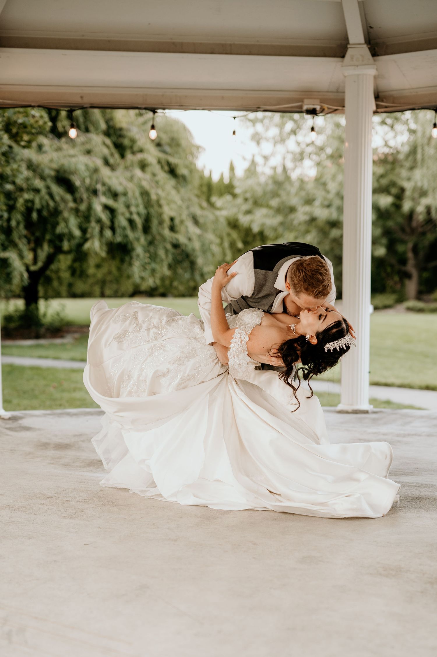bride and groom first dance under the Promise Garden gazebo