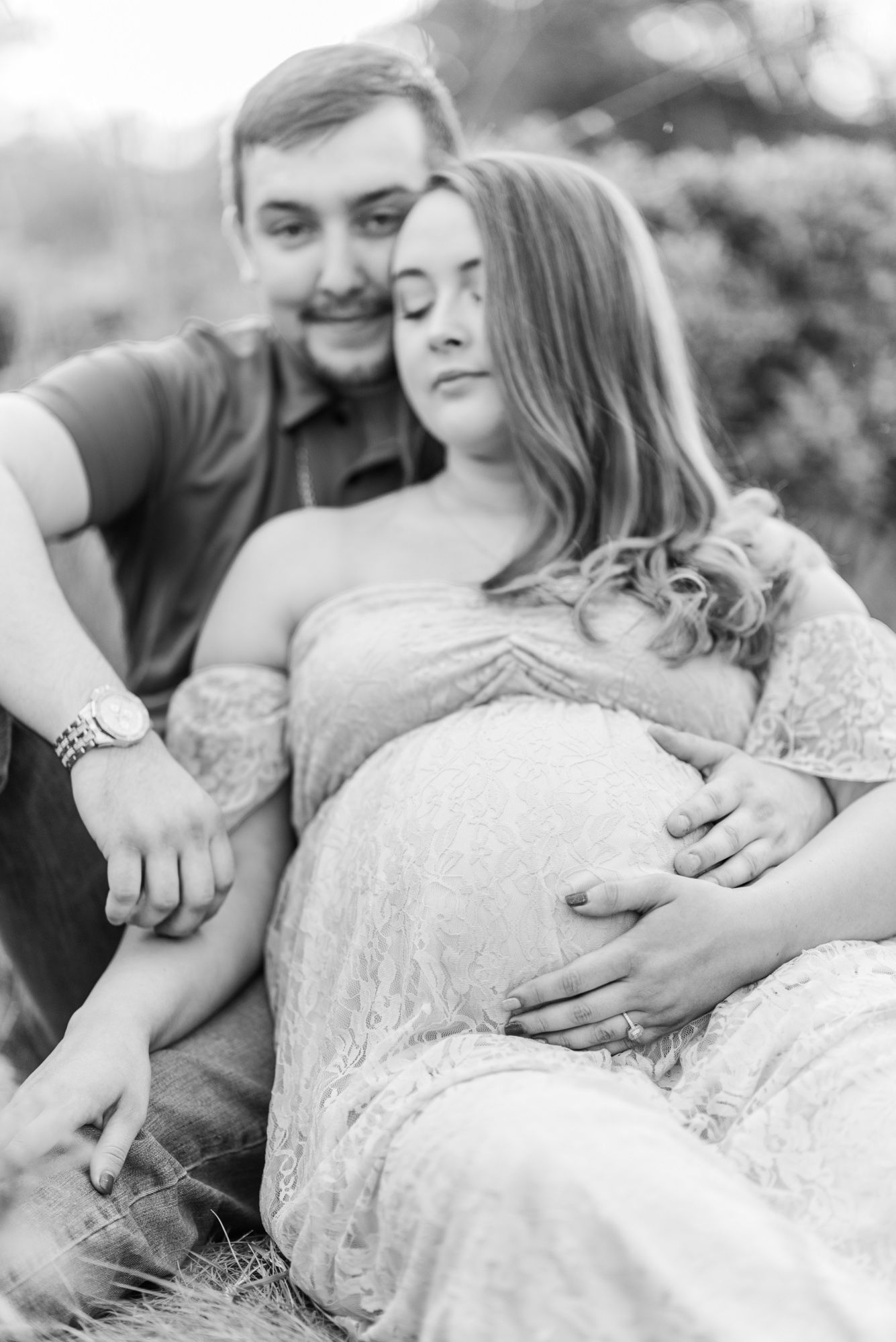 Maternity session with couple in field in golden hour sunlight at Moraine State Park, Pennsylvania