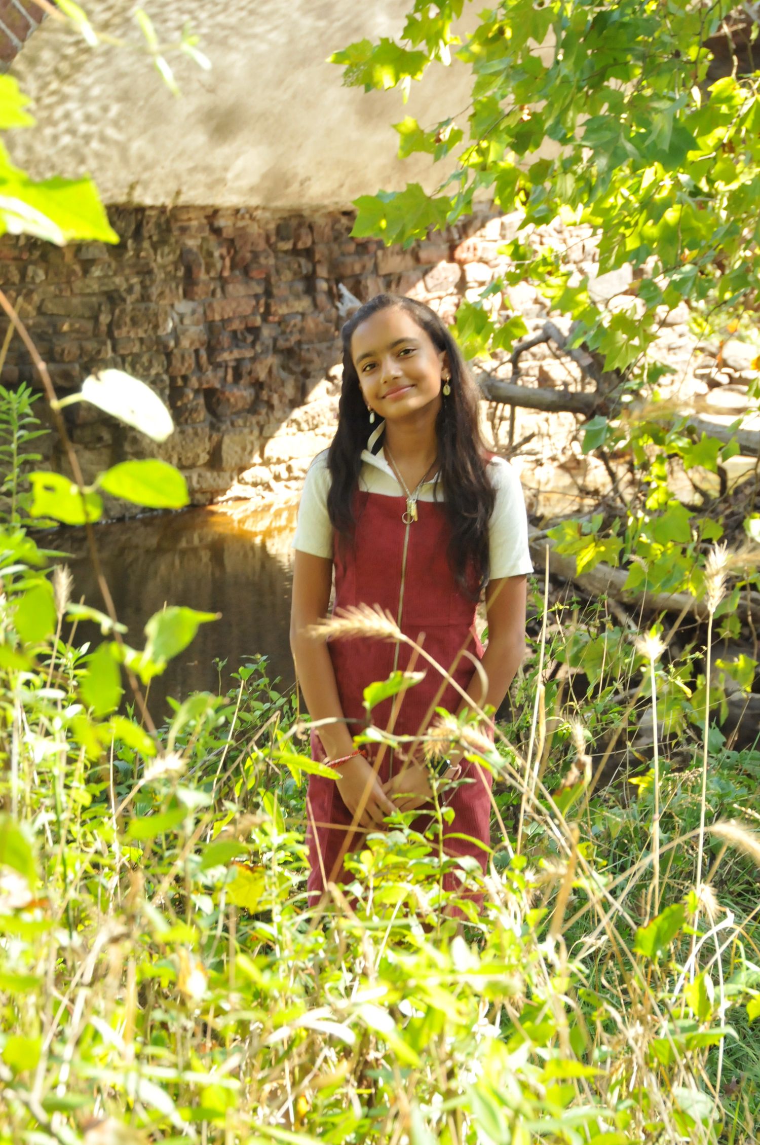 Teenager photo near stone bridge