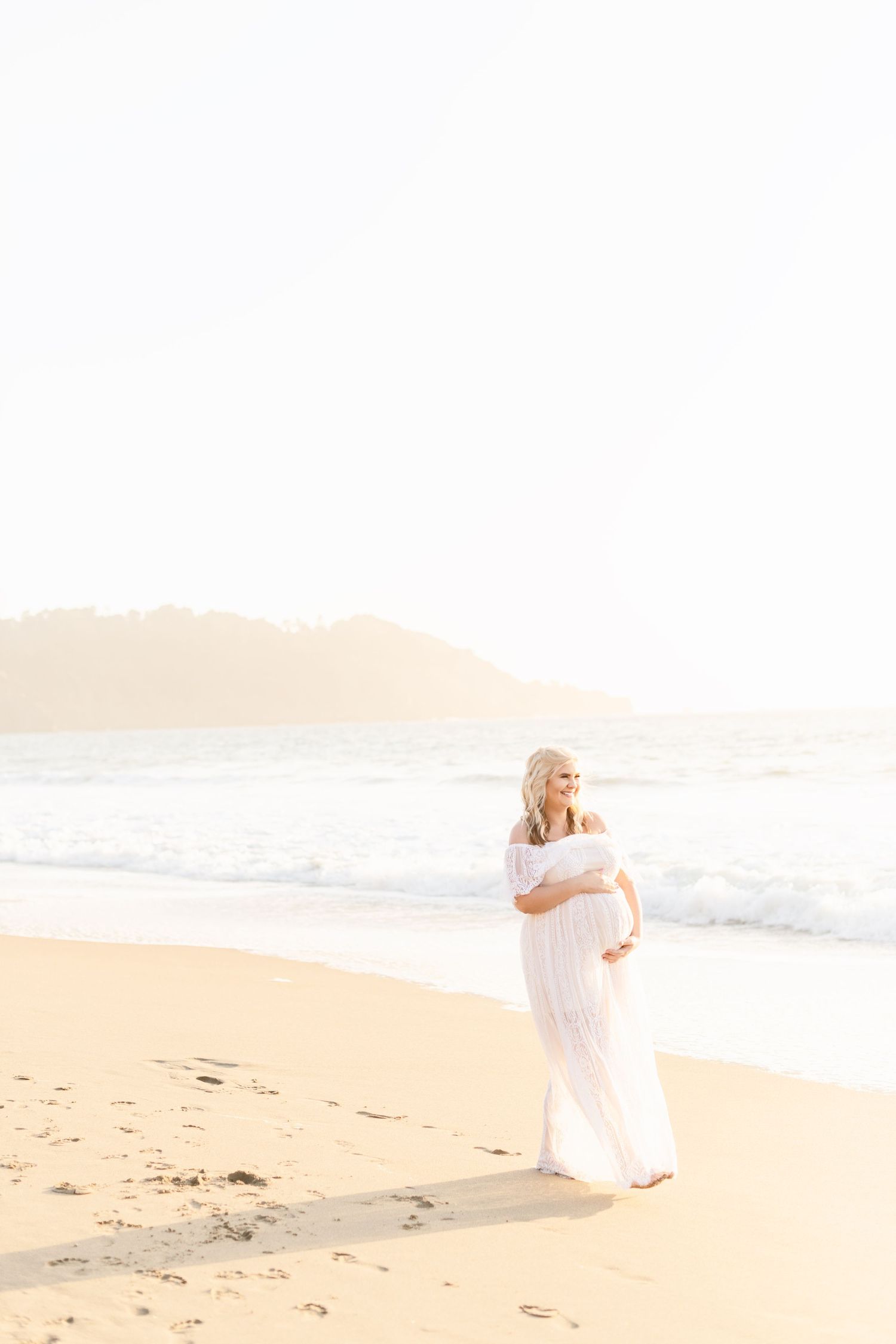 Ethereal beach photography with soft golden light and romantic coastal scenery.