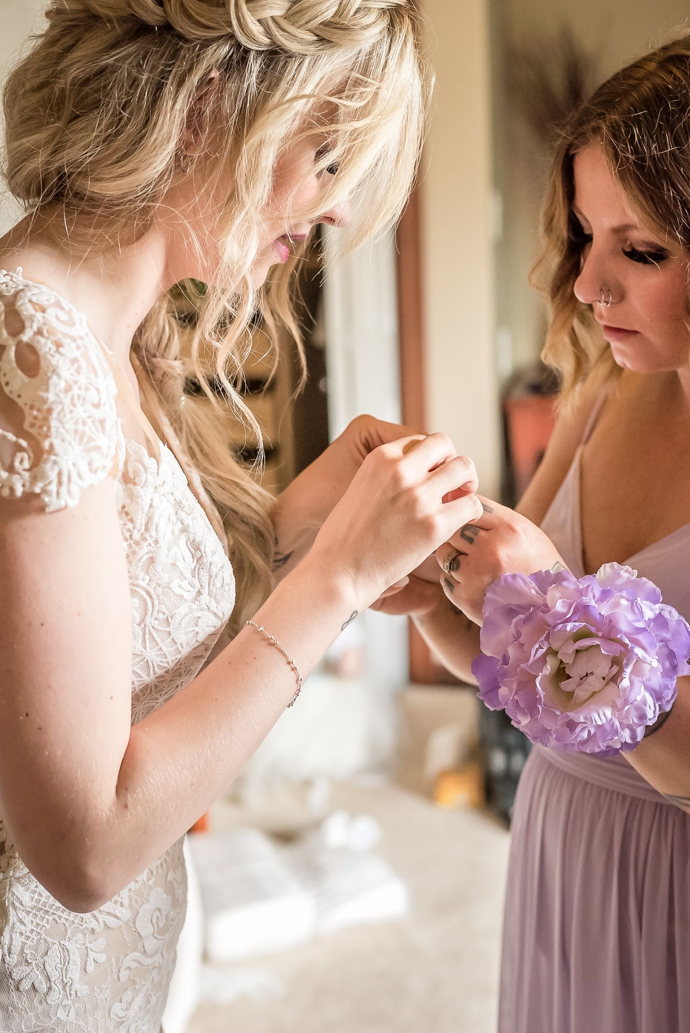 Bride putting on jewelry on wedding day. Photo taken by Kari Mills Photography, Fraser Valley photographer.