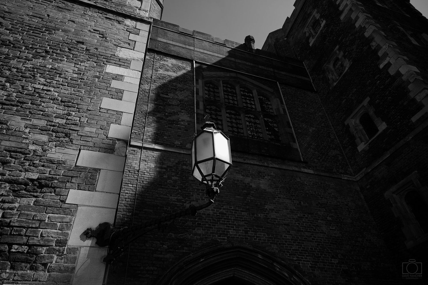 Black and white image of shadows surrounding a lamp at Morton's Tower.