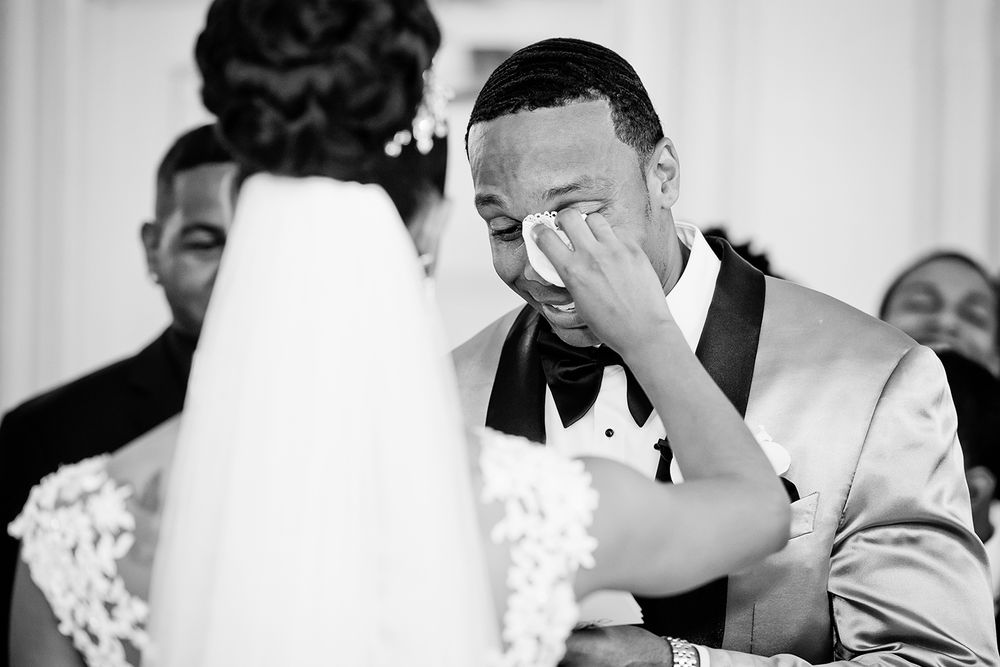groom is crying during ceremony